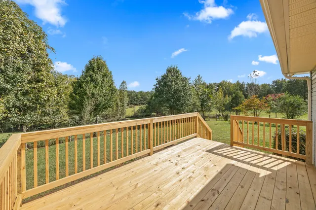 a view of a yard with swimming pool
