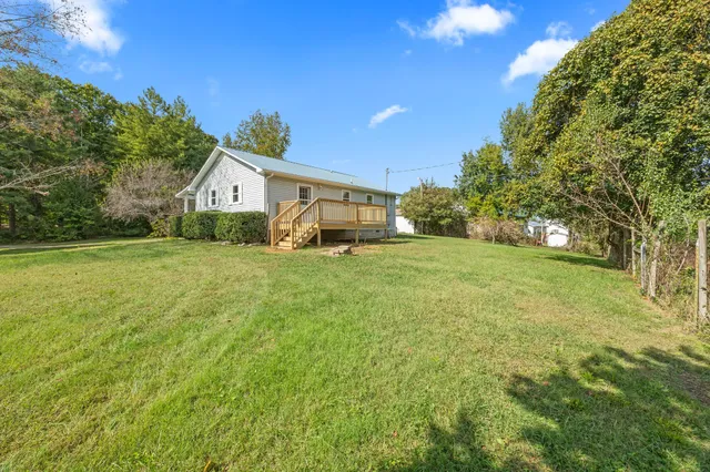 a view of a park with large trees
