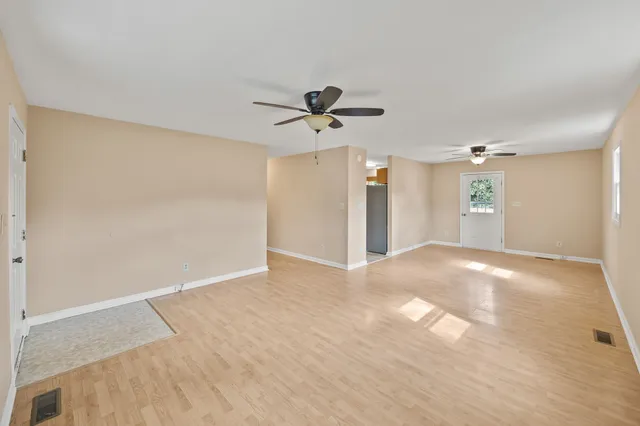 a view of a kitchen with a sink and a window