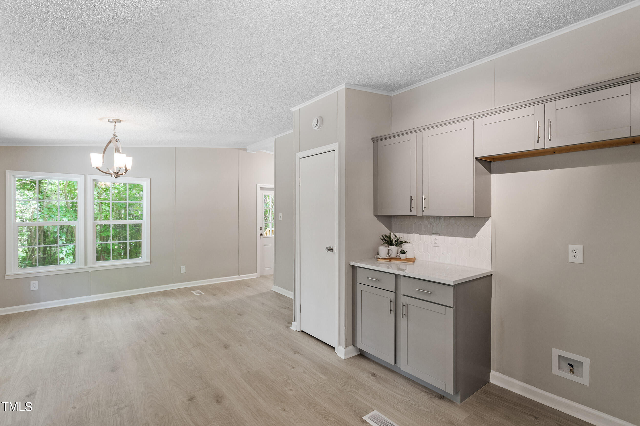 12237 Burgess Road Middlesex, NC 27557 - Photo 13 of 35 a view of a kitchen with a sink cabinets and wooden floor
