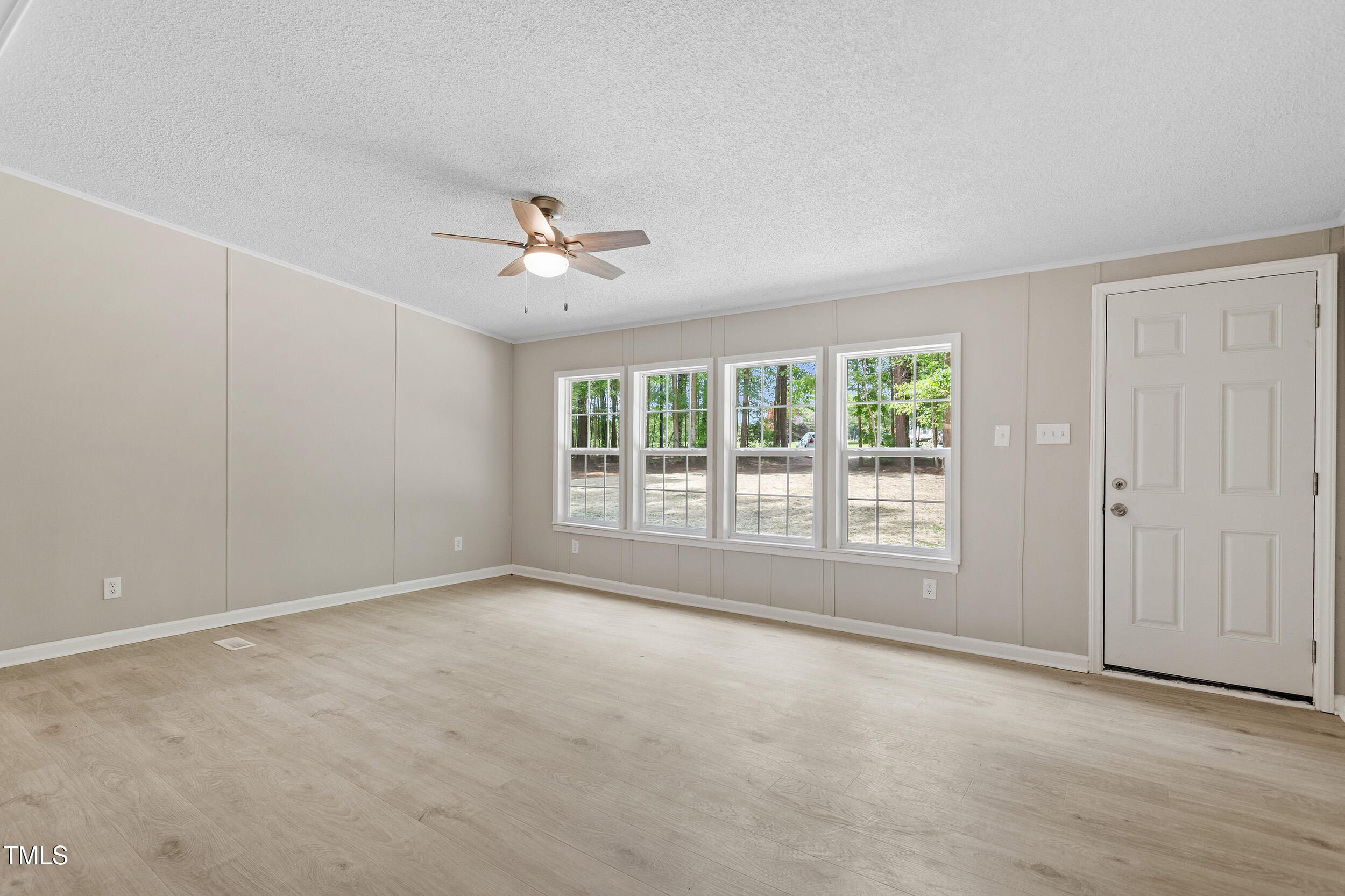 12237 Burgess Road Middlesex, NC 27557 - Photo 16 of 35 a view of an empty room with a window