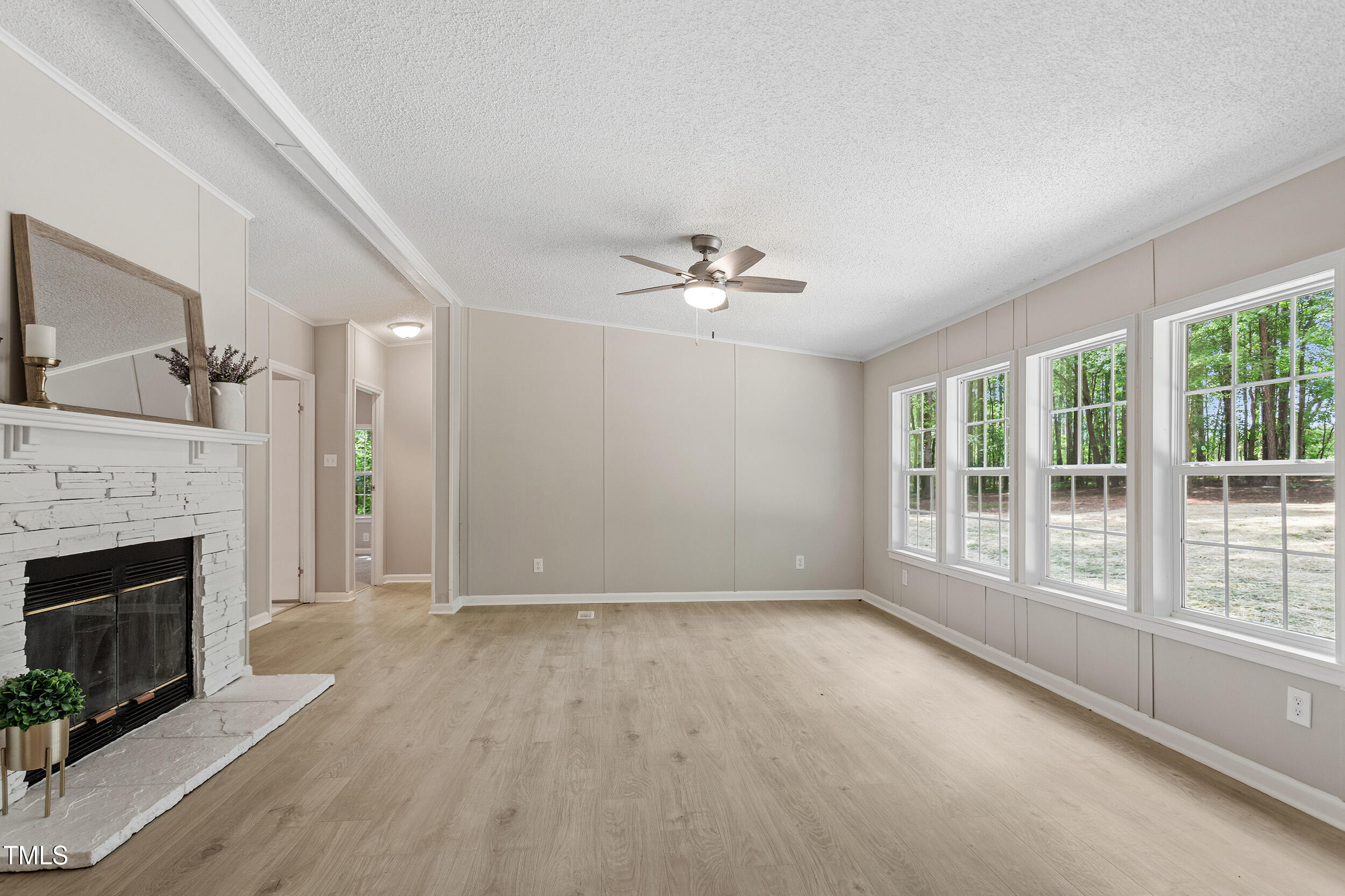 12237 Burgess Road Middlesex, NC 27557 - Photo 17 of 35 a view of an empty room with a fireplace and a window