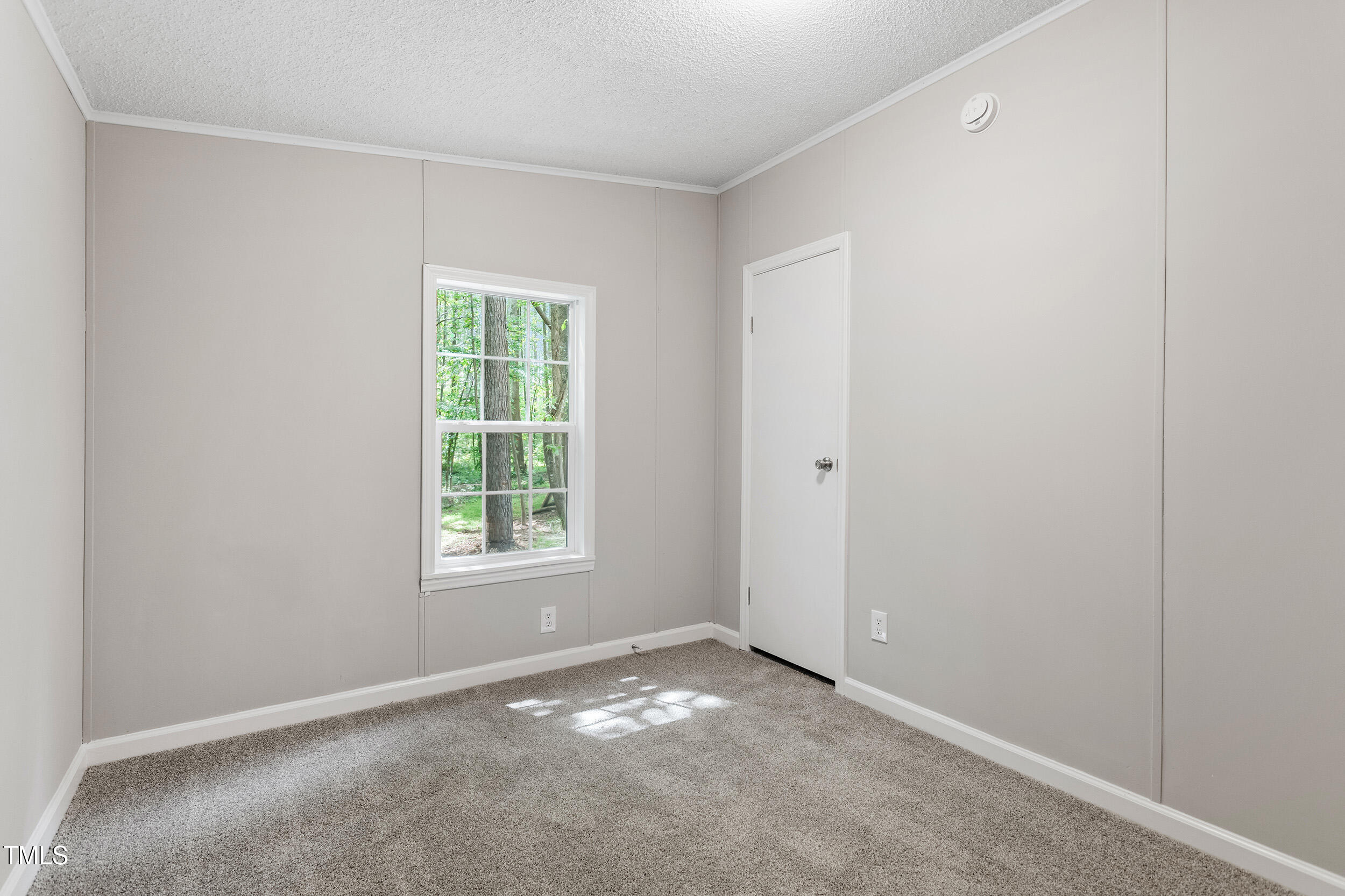 12237 Burgess Road Middlesex, NC 27557 - Photo 21 of 35 an empty room with a window