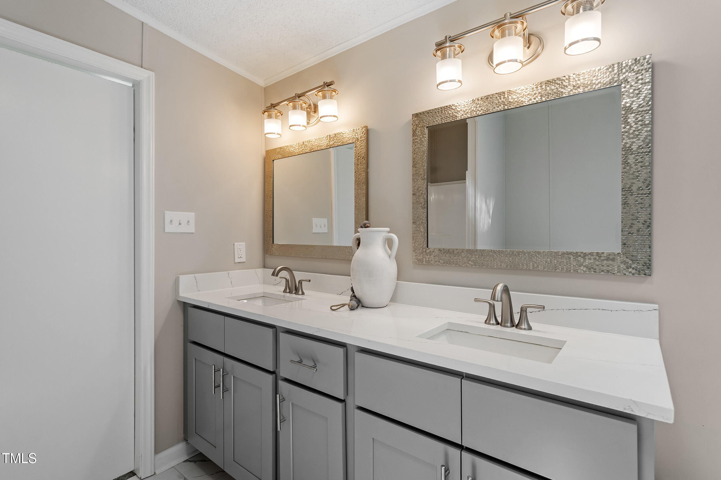12237 Burgess Road Middlesex, NC 27557 - Photo 22 of 35 a bathroom with double sink and a mirror