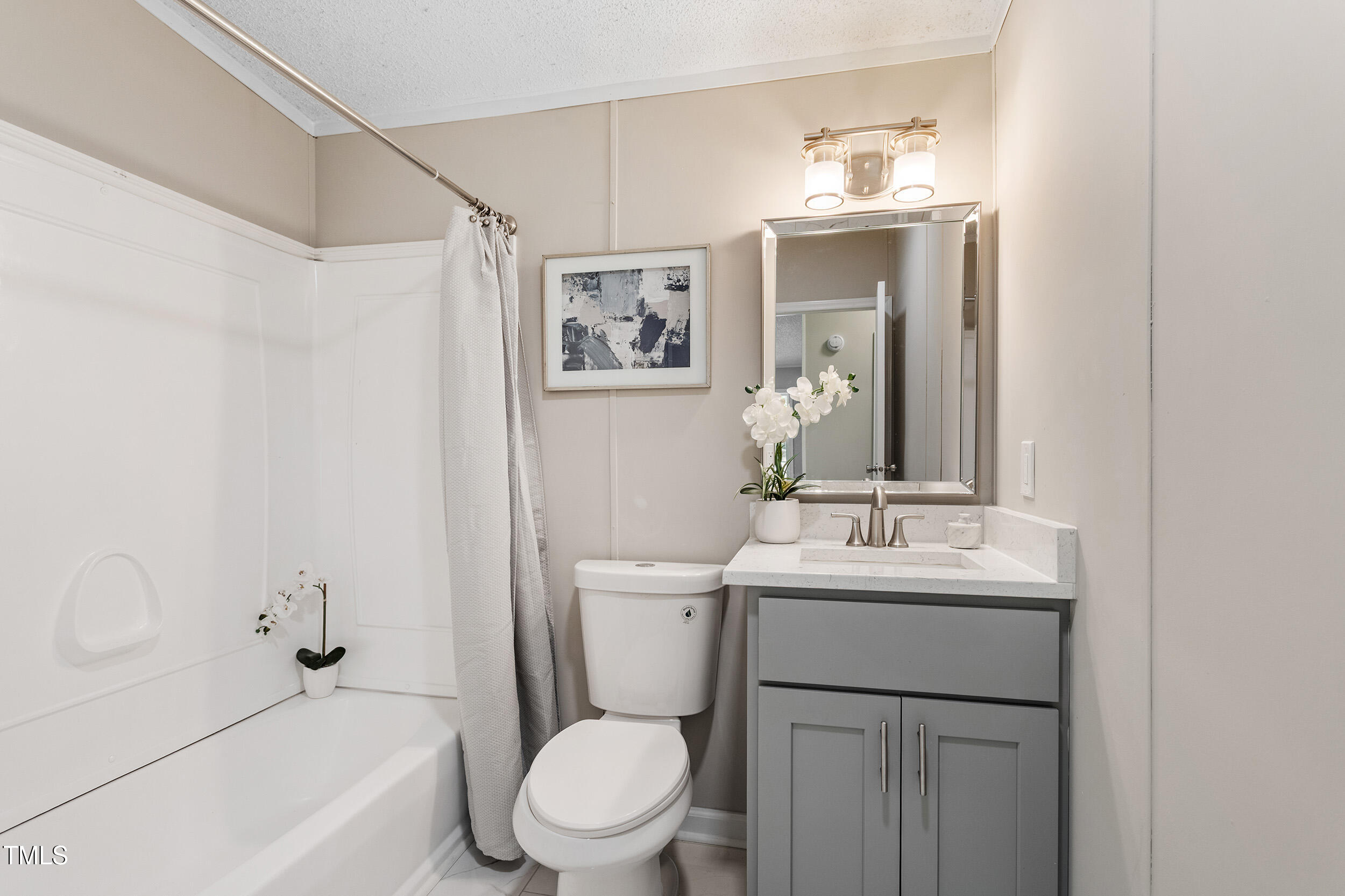 12237 Burgess Road Middlesex, NC 27557 - Photo 23 of 35 a bathroom with a sink toilet and shower