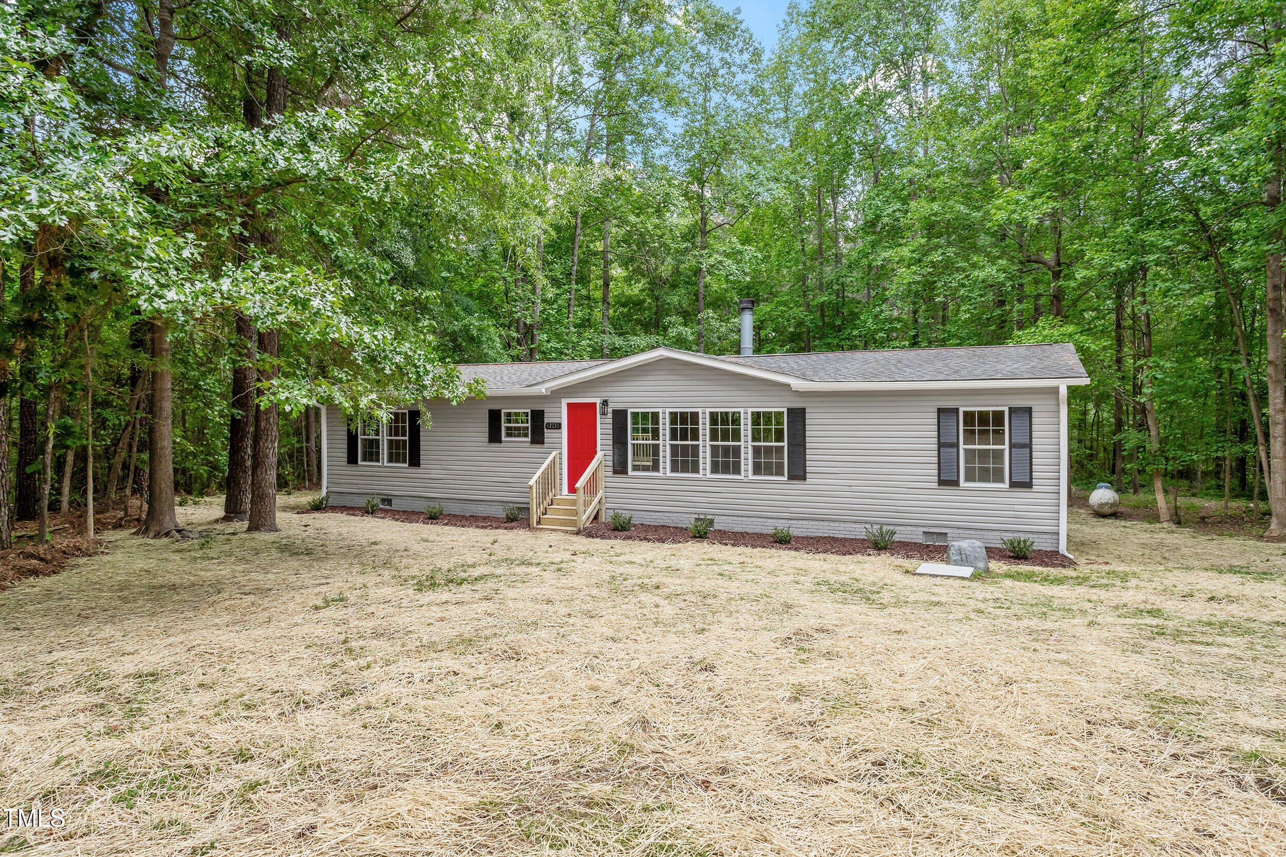 12237 Burgess Road Middlesex, NC 27557 - Photo 26 of 35 a front view of a house with a yard