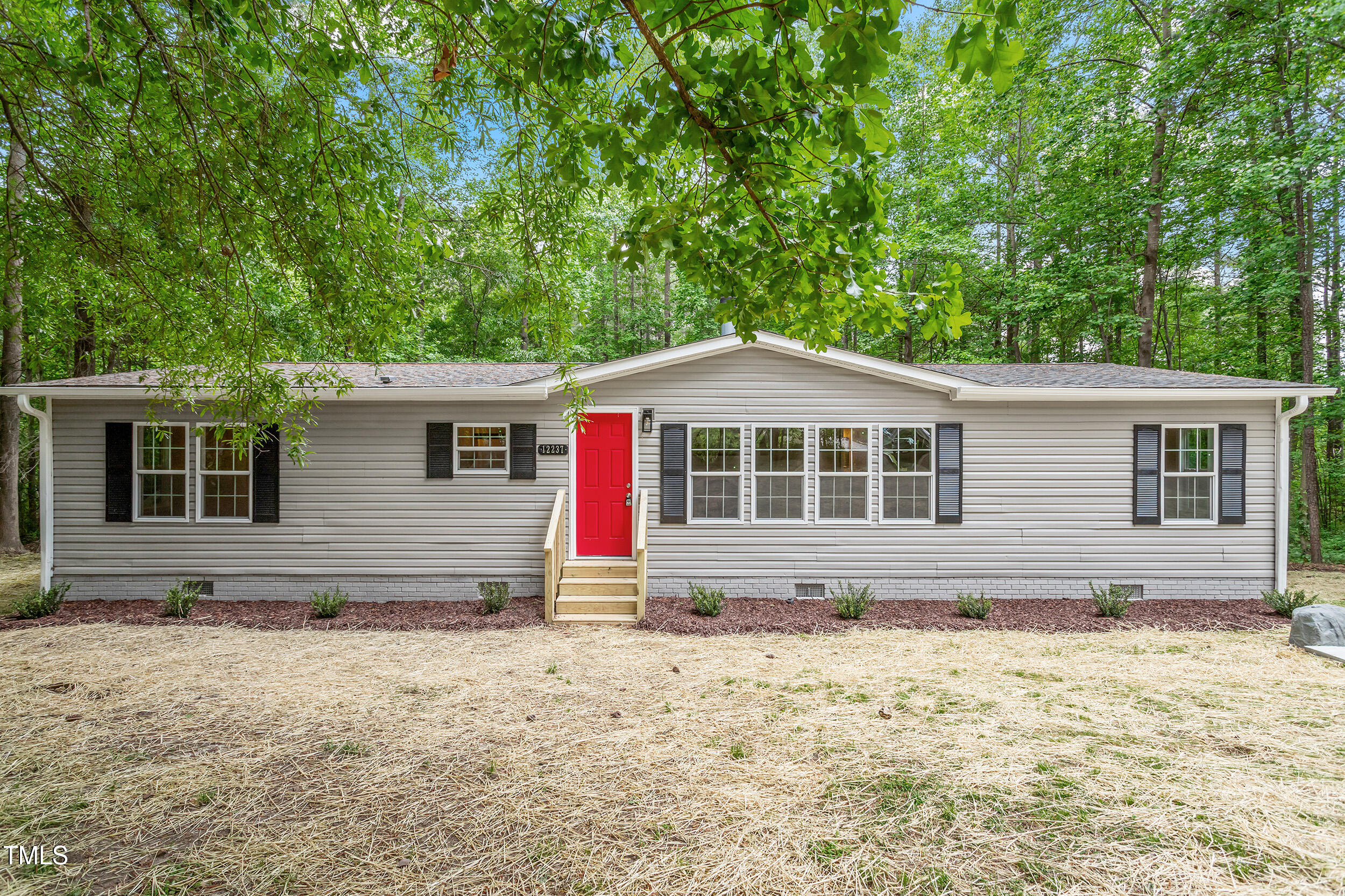 12237 Burgess Road Middlesex, NC 27557 - Photo 27 of 35 a front view of a house with a yard