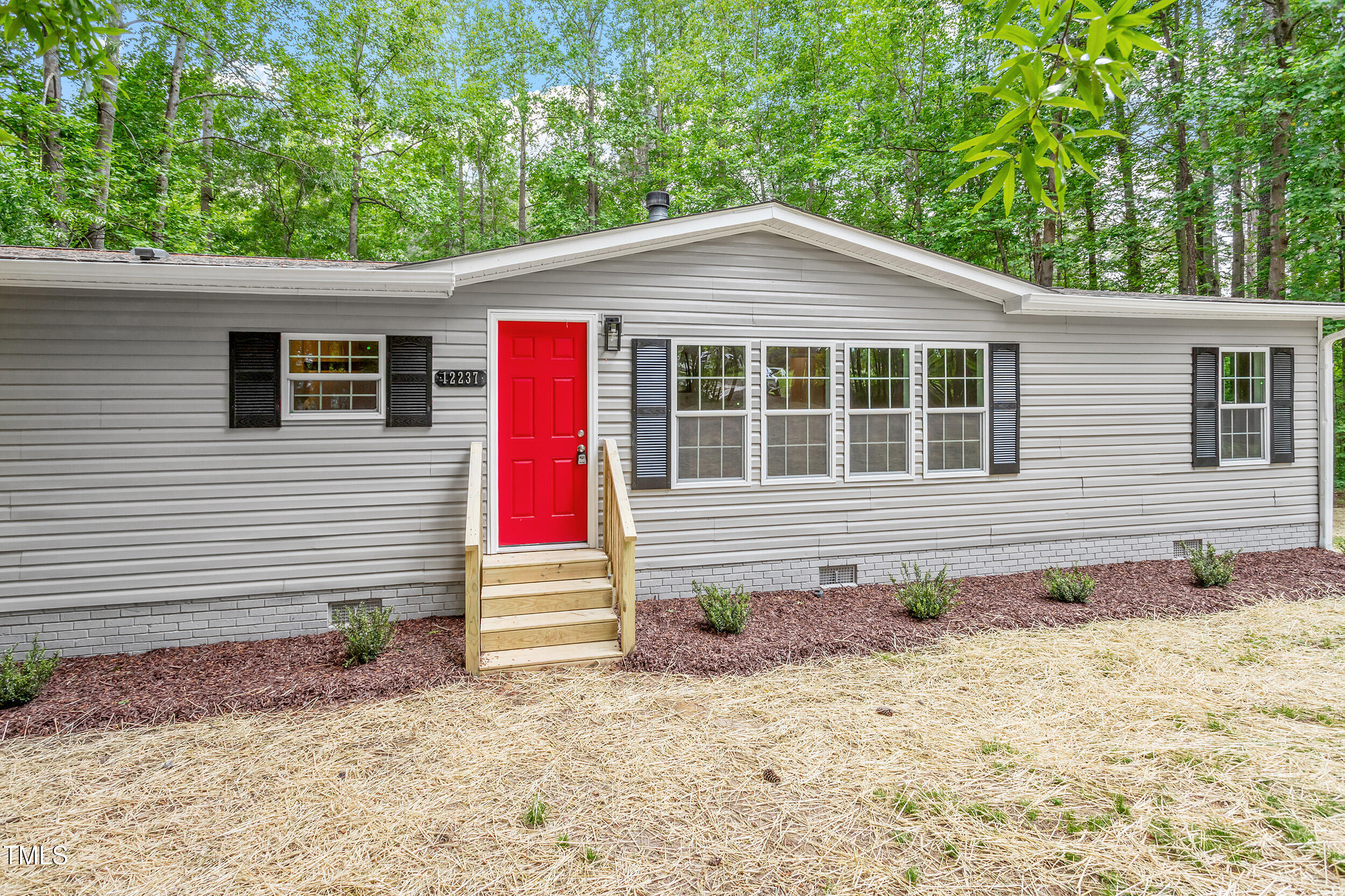 12237 Burgess Road Middlesex, NC 27557 - Photo 28 of 35 a front view of a house with a yard