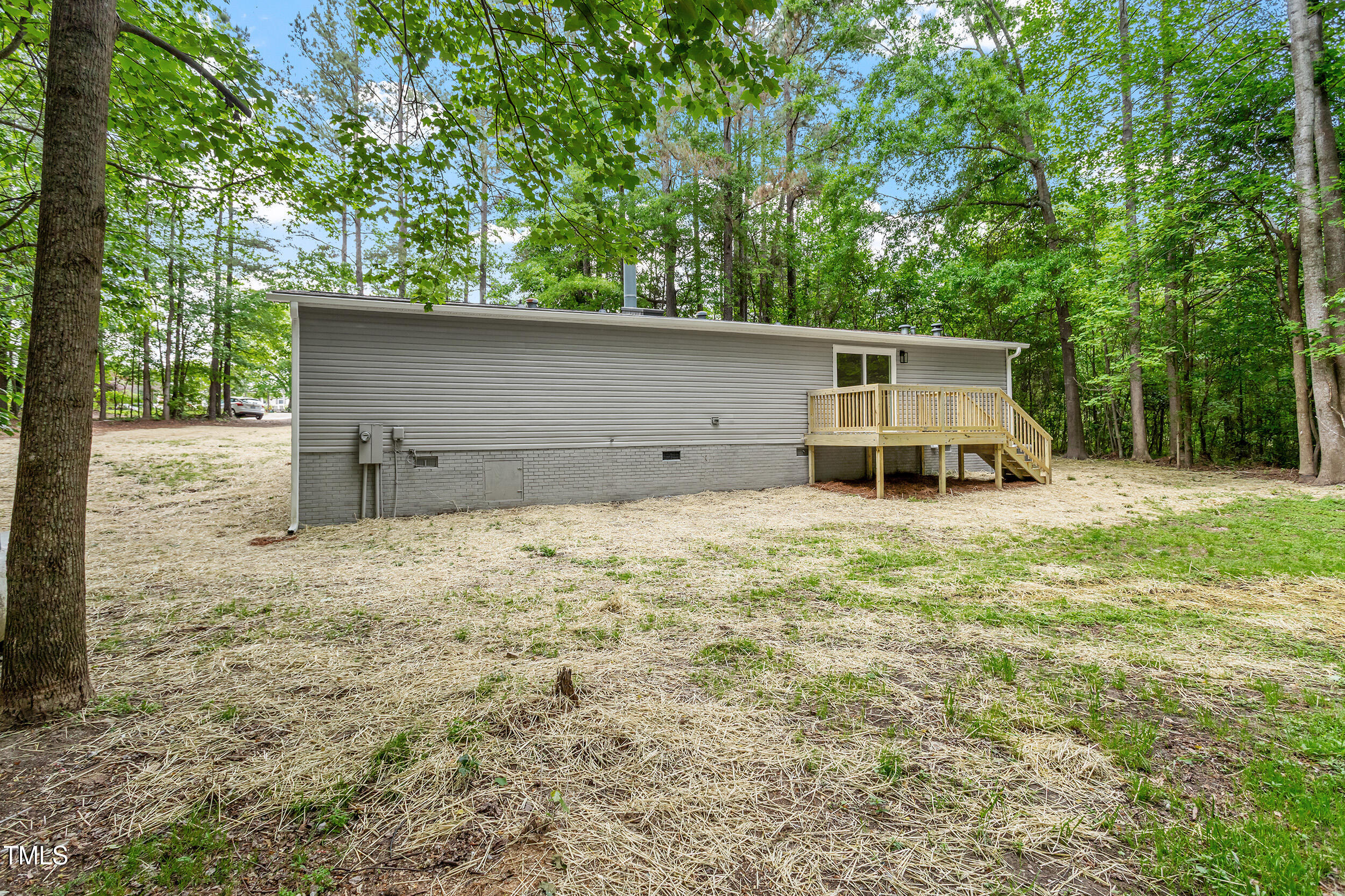 12237 Burgess Road Middlesex, NC 27557 - Photo 31 of 35 a backyard of a house with table and chairs