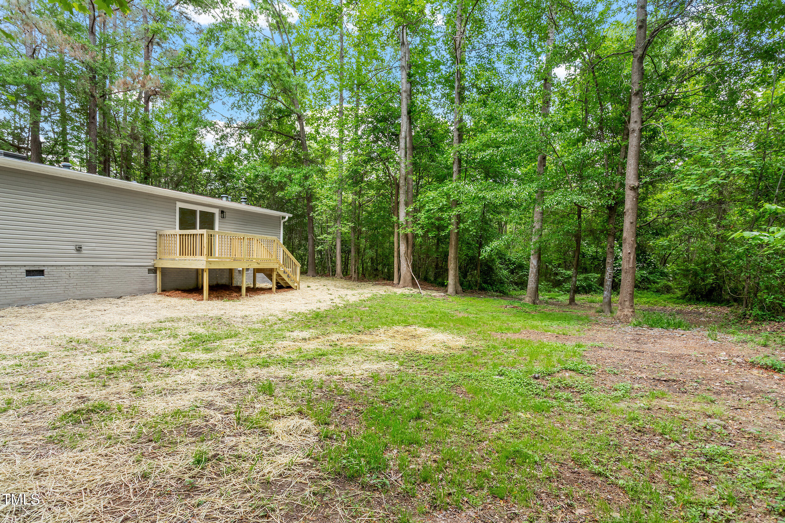 12237 Burgess Road Middlesex, NC 27557 - Photo 32 of 35 a house with trees in the background