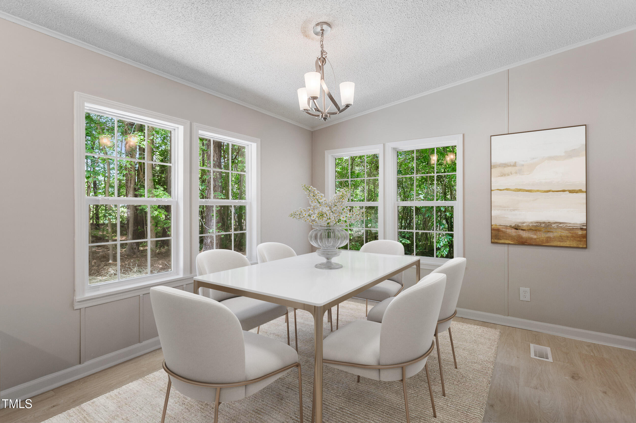 12237 Burgess Road Middlesex, NC 27557 - Photo 6 of 35 a view of a dining room with furniture large windows and wooden floor