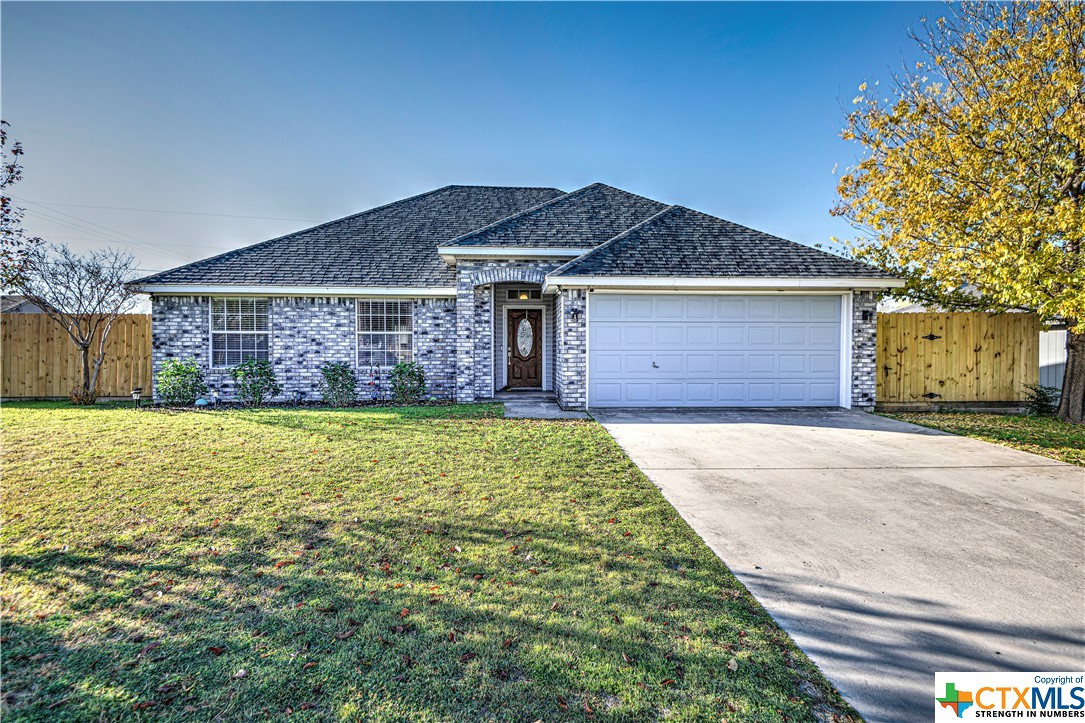 2702 Cactus Drive Killeen, TX 76549 - Photo 1 of 1 a front view of a house with a garden