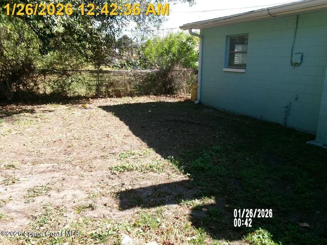 a bathroom with a bathtub toilet and window