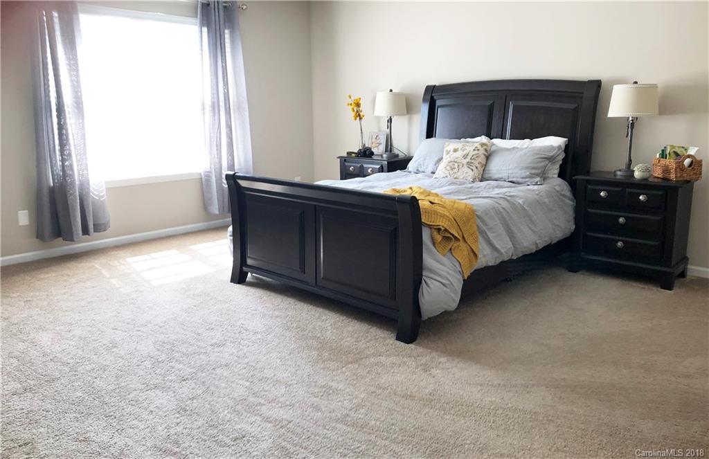777 Jones Branch Road Fort Mill, SC 29715 - Photo 13 of 27 a bedroom with a bed and a dresser