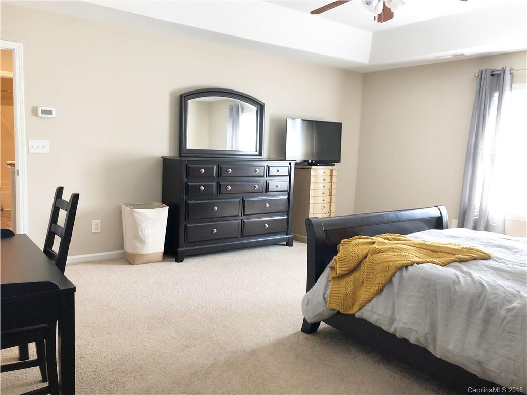 777 Jones Branch Road Fort Mill, SC 29715 - Photo 14 of 27 a bedroom with a bed and a television