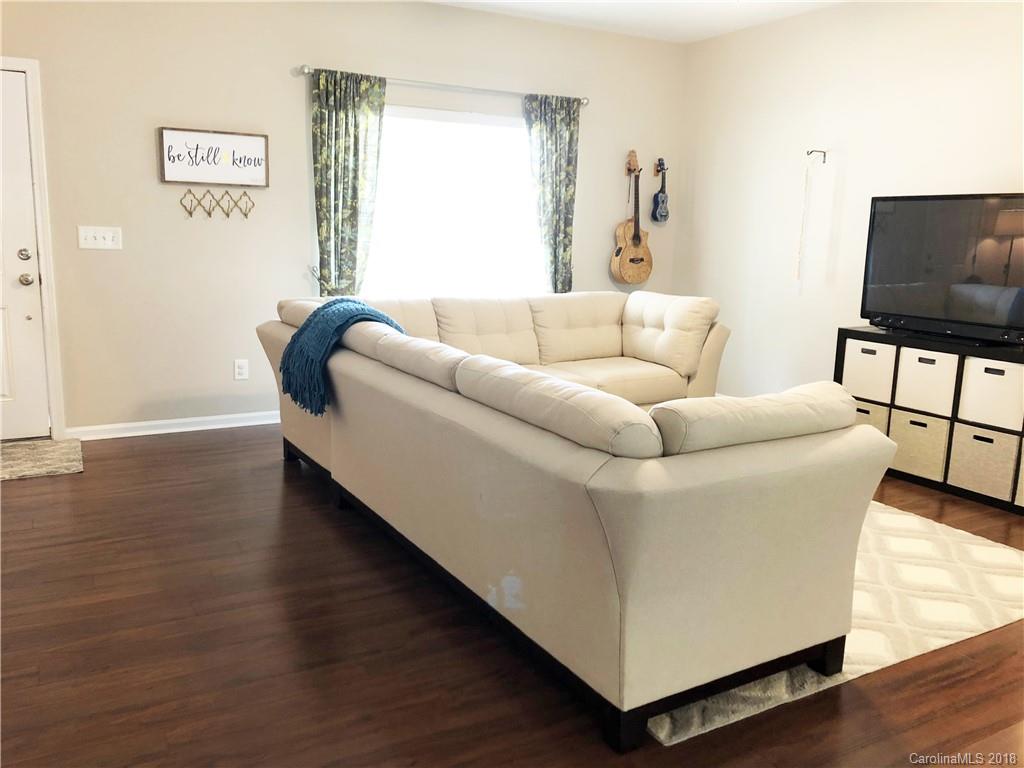 777 Jones Branch Road Fort Mill, SC 29715 - Photo 4 of 27 a living room with furniture and a flat screen tv
