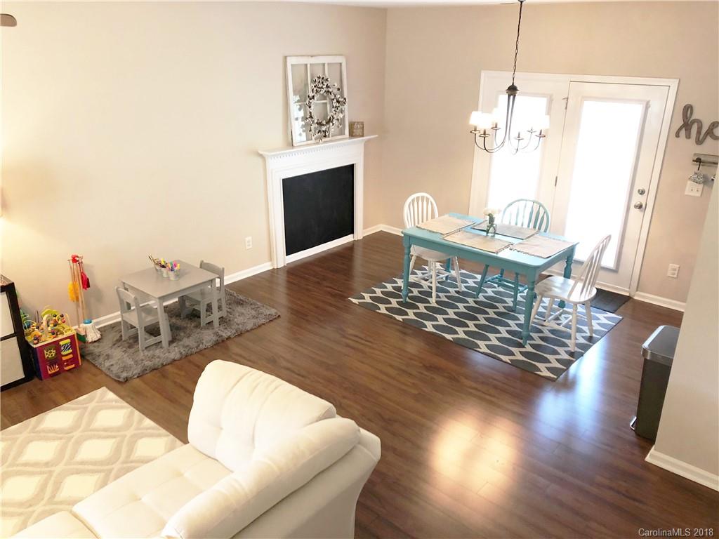 777 Jones Branch Road Fort Mill, SC 29715 - Photo 6 of 27 a living room with dining room and wooden floor