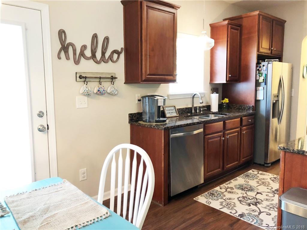 777 Jones Branch Road Fort Mill, SC 29715 - Photo 8 of 27 a kitchen with stainless steel appliances granite countertop a refrigerator sink and cabinets