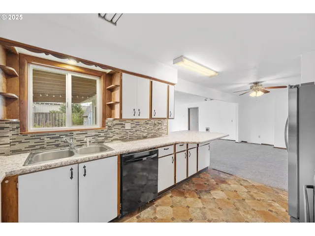 a kitchen with a sink and cabinets
