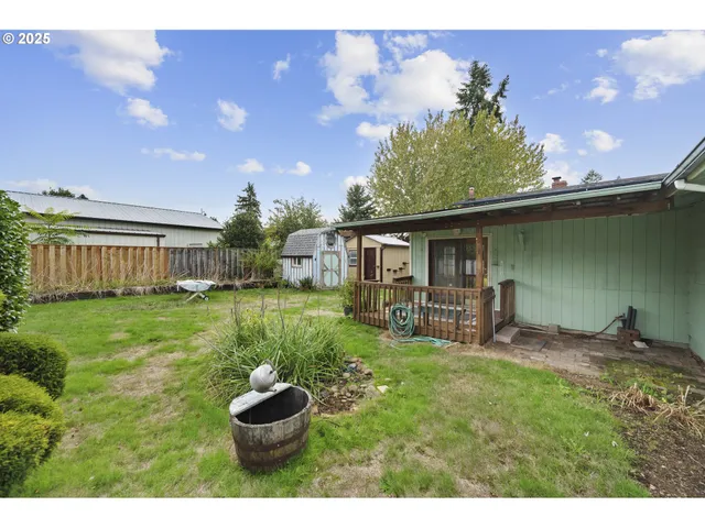 a house view with a sitting space and garden