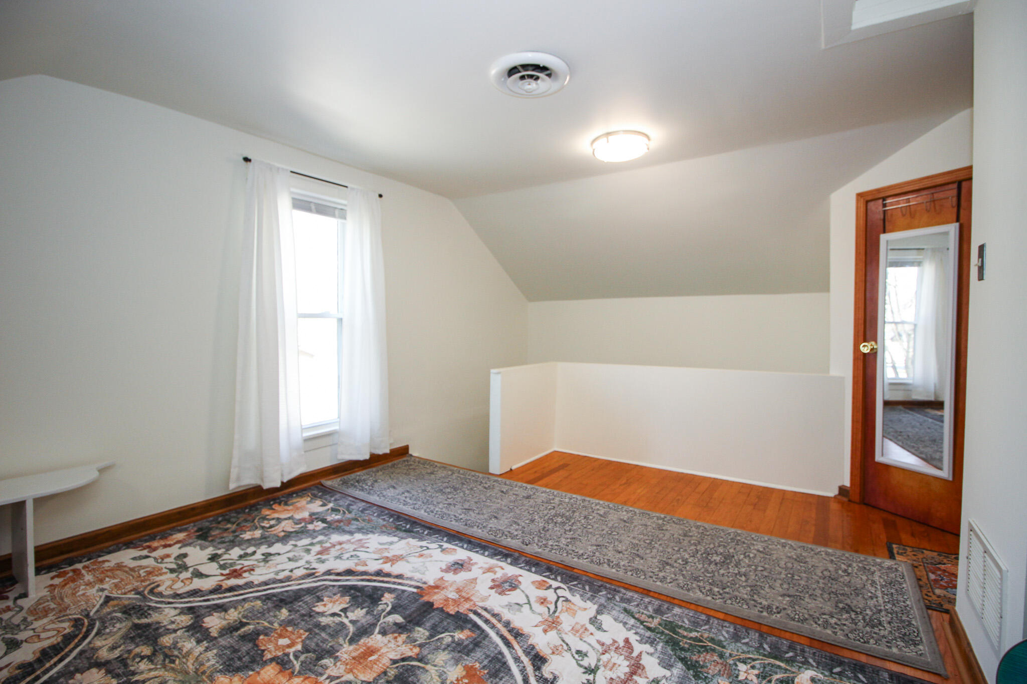 1765 Tower Street Chesterton, IN 46304 - Photo 18 of 27 a bedroom with a bed and wooden floor