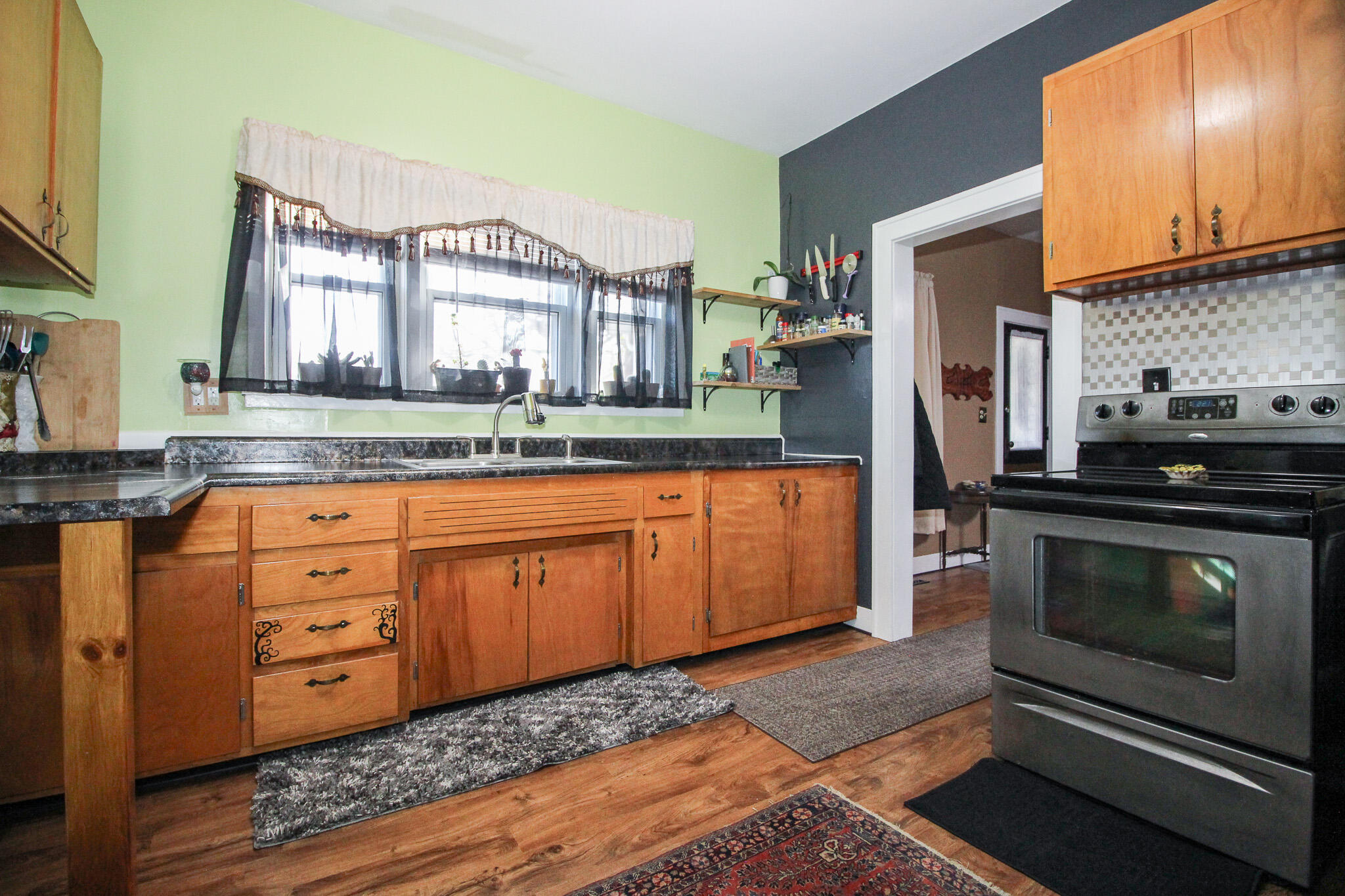 1765 Tower Street Chesterton, IN 46304 - Photo 10 of 27 a kitchen with stainless steel appliances granite countertop a stove a sink and a microwave