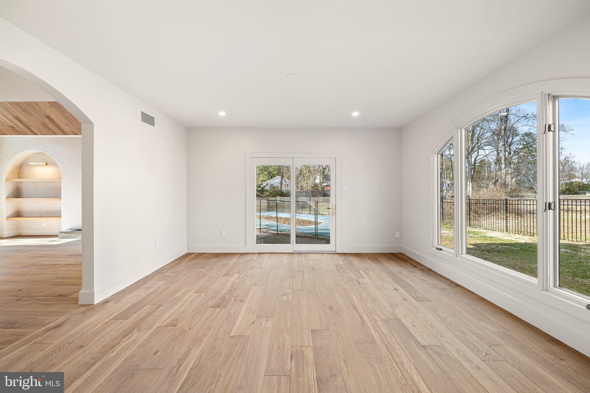 1555 Beechnut Circle Ambler, PA 19002 - Photo 19 of 58 a view of an empty room with wooden floor and a window