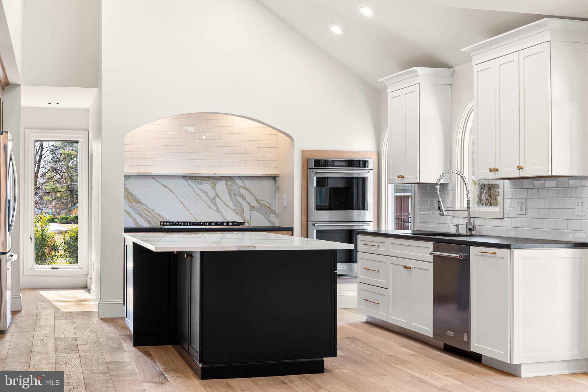 1555 Beechnut Circle Ambler, PA 19002 - Photo 24 of 58 a kitchen with stainless steel appliances granite countertop a stove a sink and a microwave