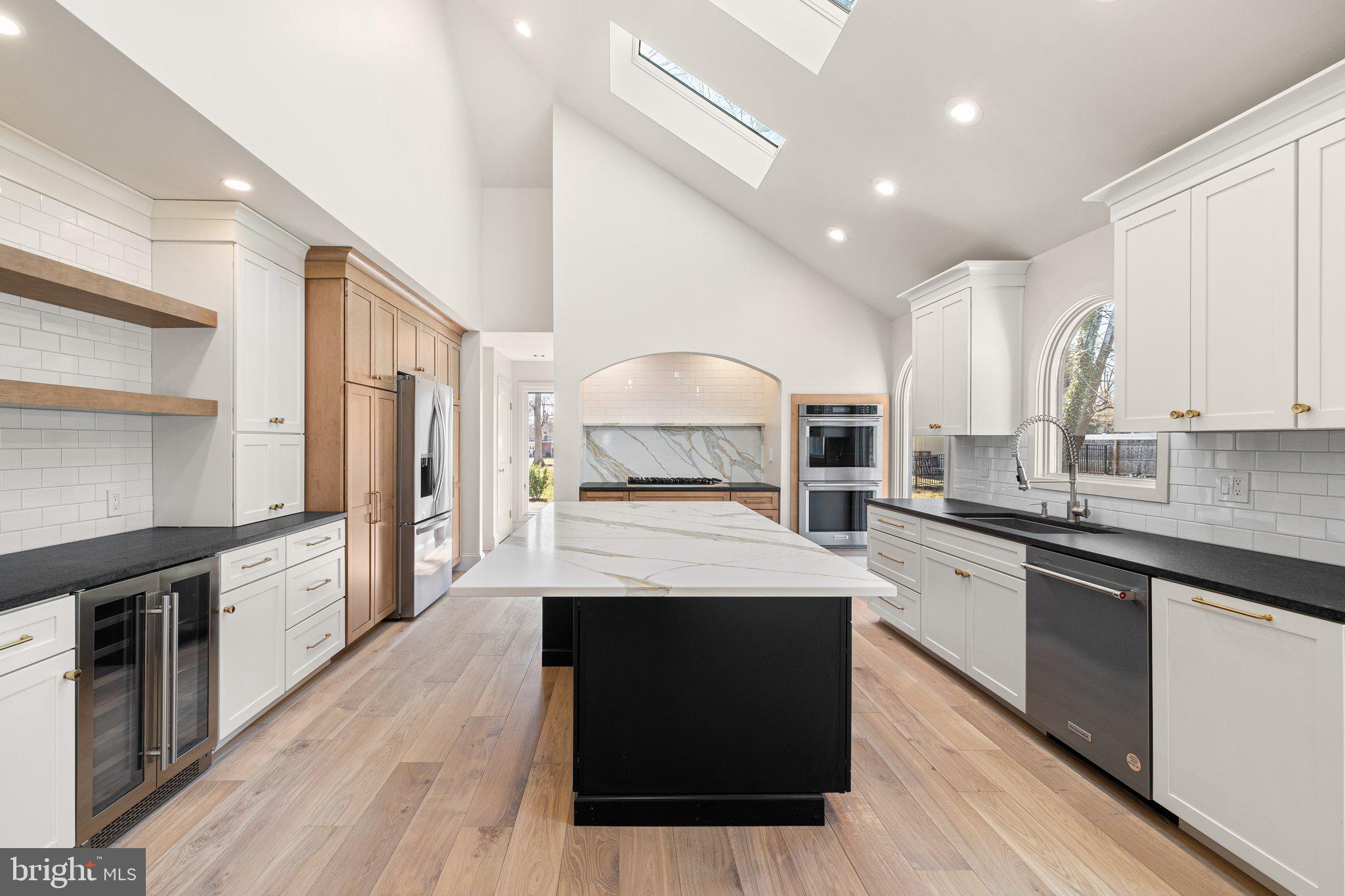 1555 Beechnut Circle Ambler, PA 19002 - Photo 25 of 58 a large kitchen with stainless steel appliances kitchen island granite countertop a stove and a sink