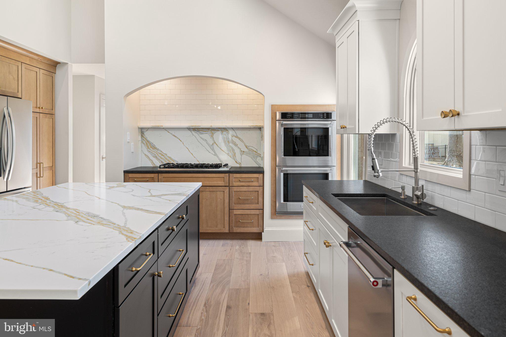 1555 Beechnut Circle Ambler, PA 19002 - Photo 26 of 58 a kitchen with granite countertop a sink stove and cabinets