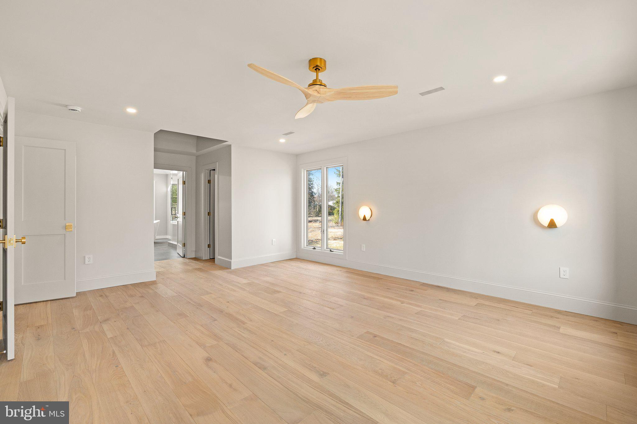 1555 Beechnut Circle Ambler, PA 19002 - Photo 34 of 58 a view of an empty room with glass door and a ceiling fan