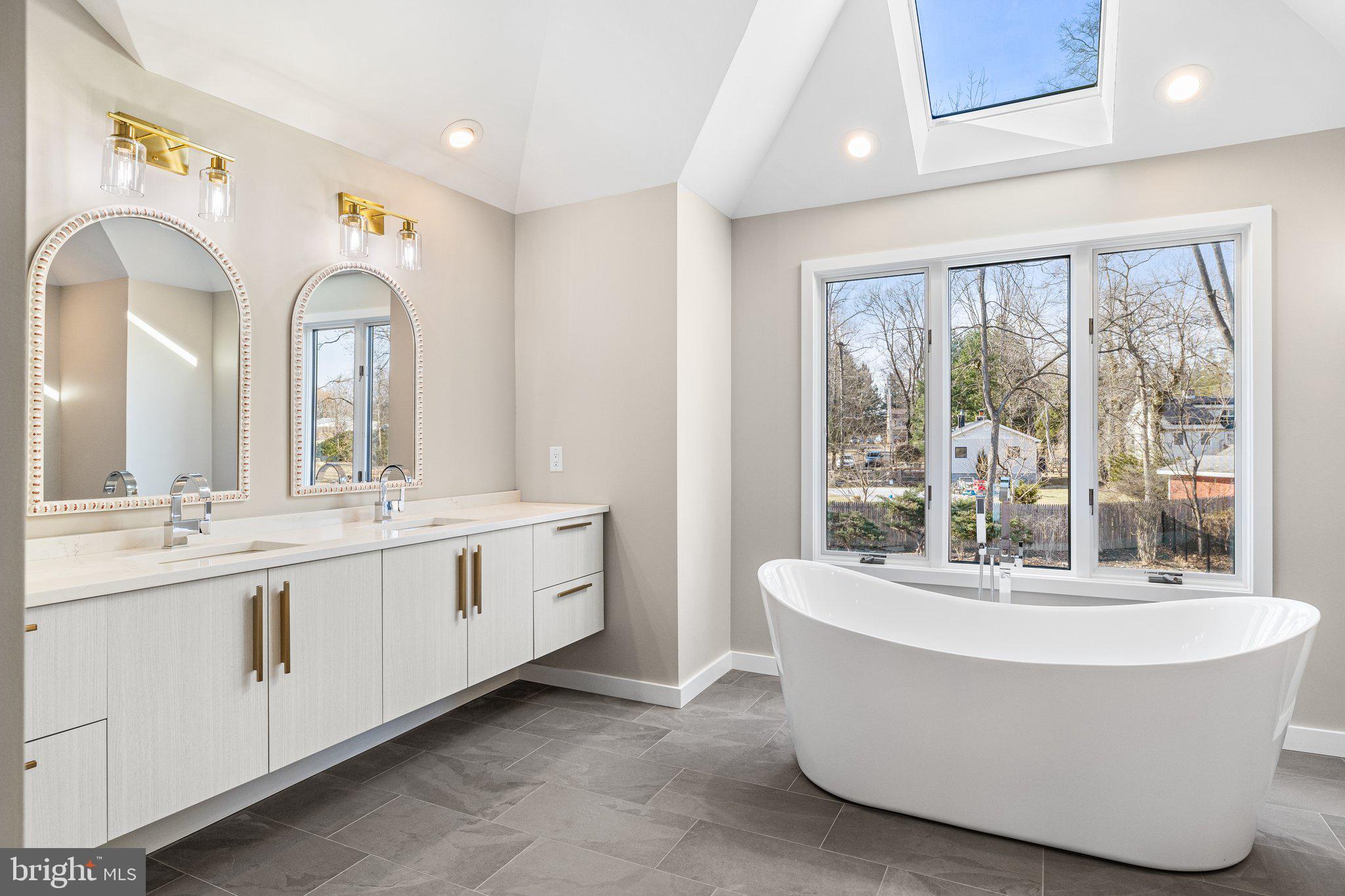 1555 Beechnut Circle Ambler, PA 19002 - Photo 37 of 58 a bathroom with a double vanity sink and a bathtub