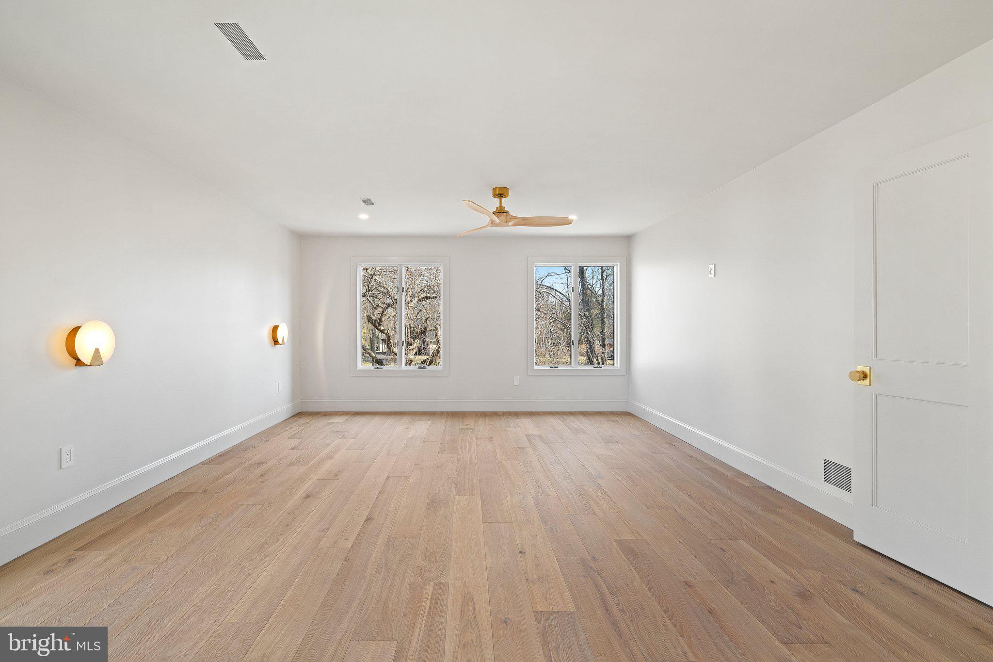 1555 Beechnut Circle Ambler, PA 19002 - Photo 42 of 58 a view of an empty room with wooden floor and windows