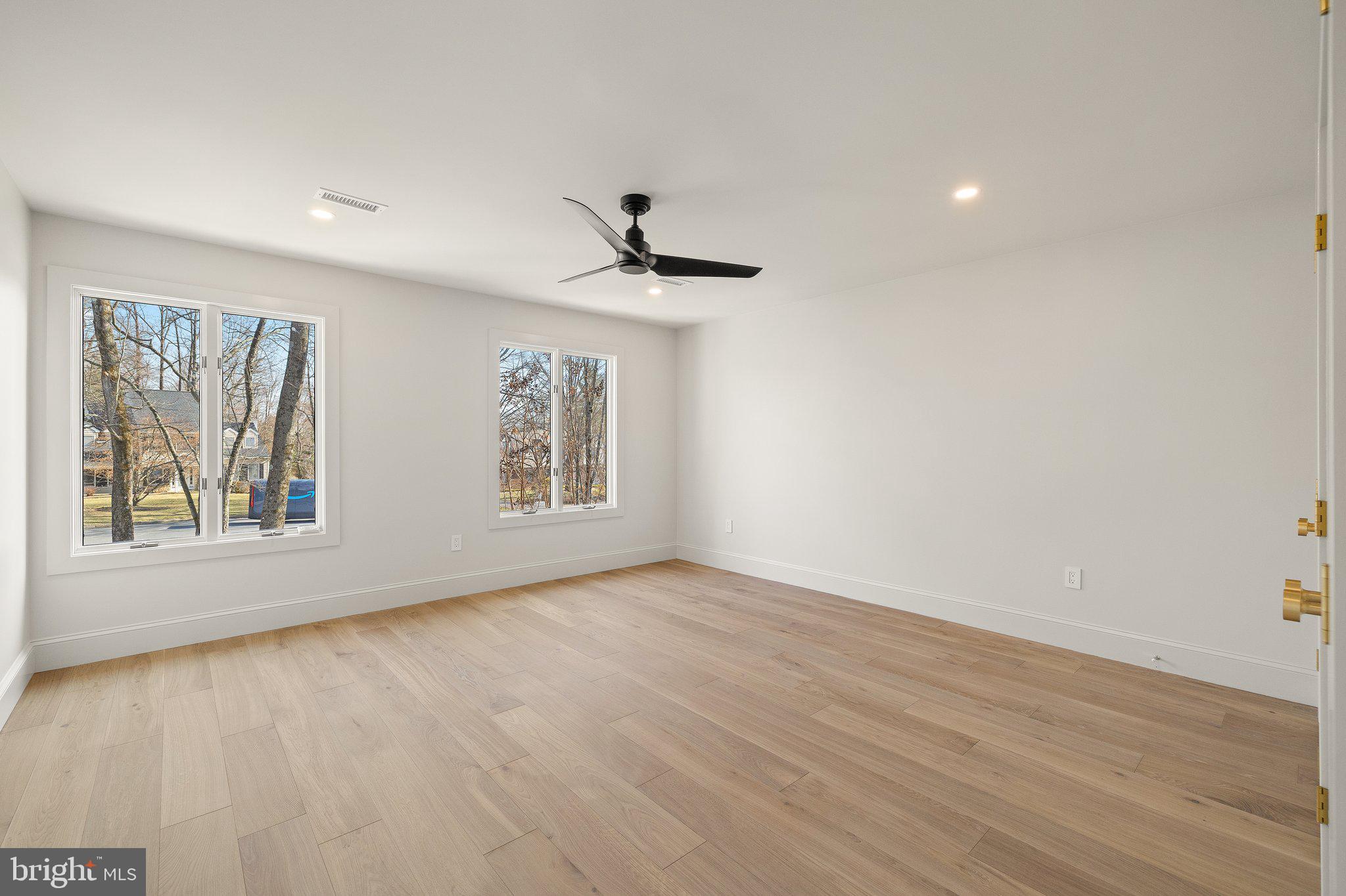 1555 Beechnut Circle Ambler, PA 19002 - Photo 48 of 58 a view of an empty room with a window and wooden floor