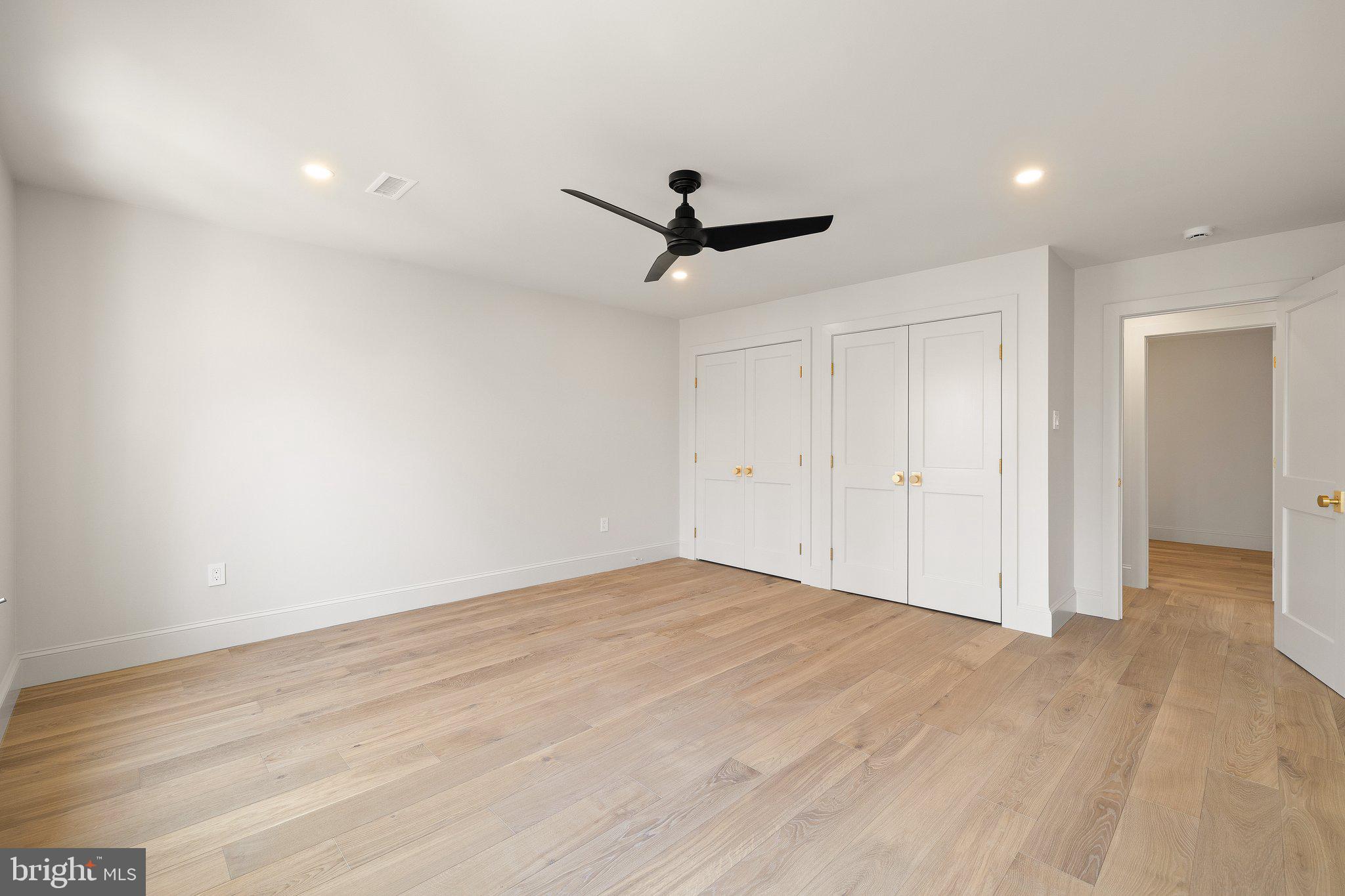 1555 Beechnut Circle Ambler, PA 19002 - Photo 49 of 58 wooden floor in an empty room with a ceiling fan