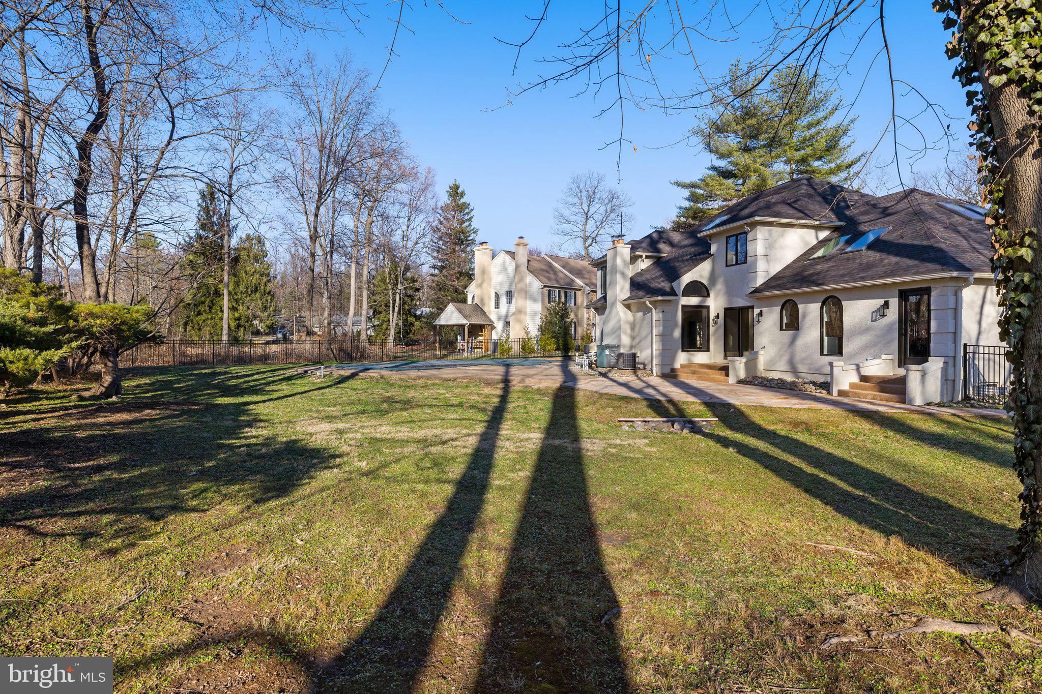 1555 Beechnut Circle Ambler, PA 19002 - Photo 57 of 58 a view of swimming pool with outdoor seating and trees in the background