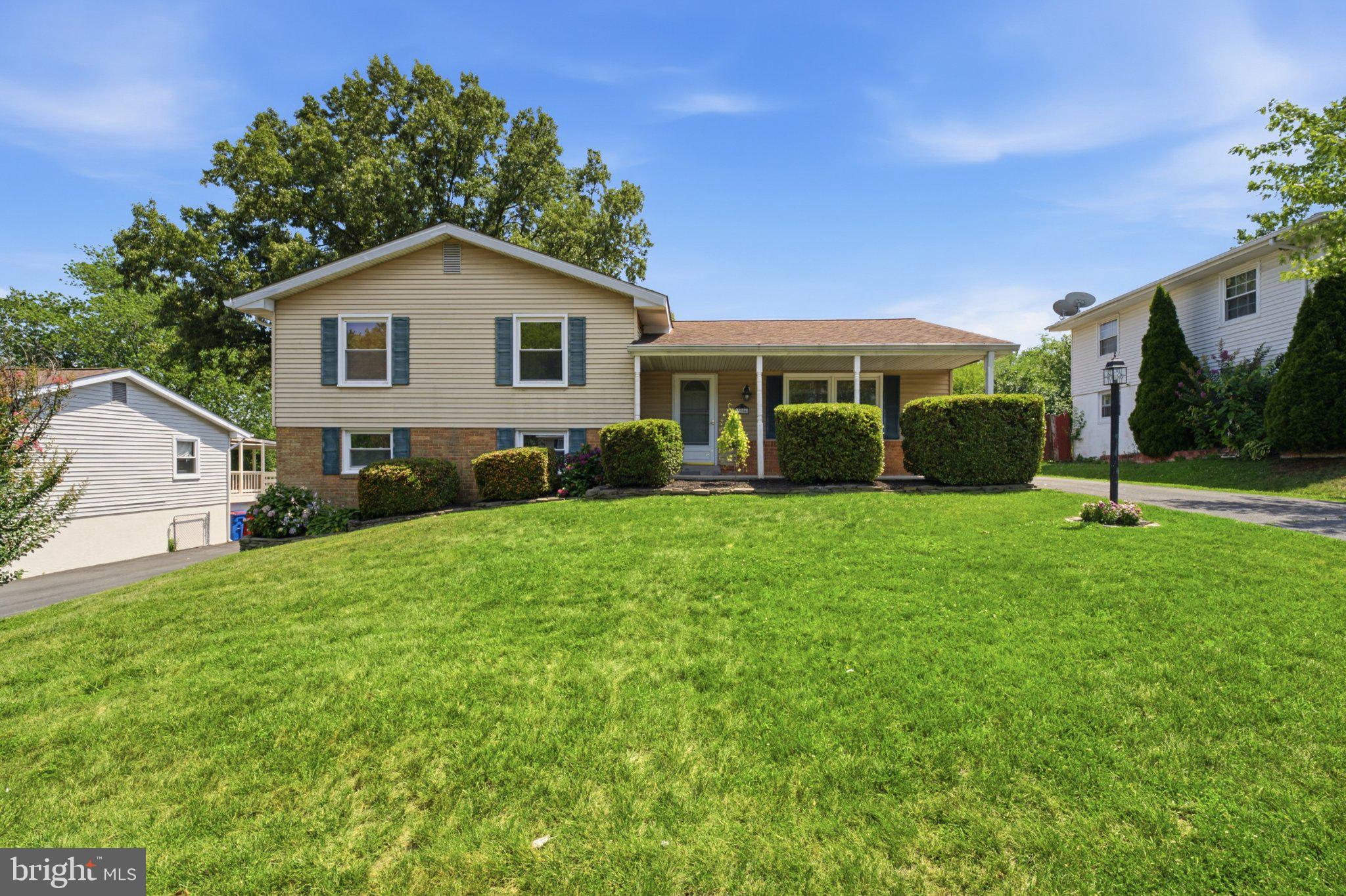 1206 East Iberia Road Sterling, VA 20164 - Photo 2 of 48 Charming home with lush green lawn.
