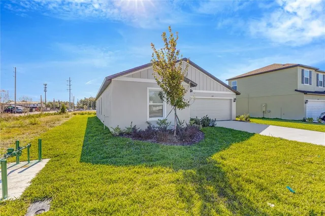 a view of a backyard with potted plants
