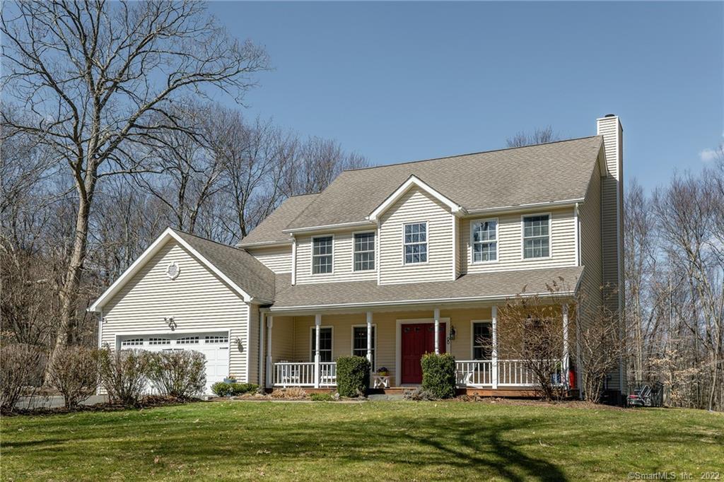 8 Chapel Hill Road Sherman, CT 06784 - Photo 1 of 1 a view of a white house next to a yard with plants and trees