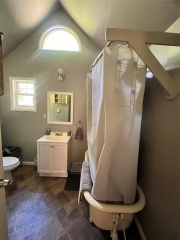 a room with a washing machine and sink