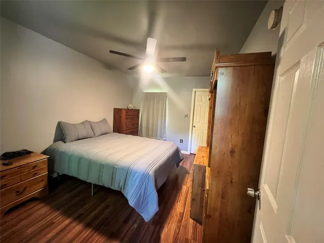 a bedroom with a bed and a closet