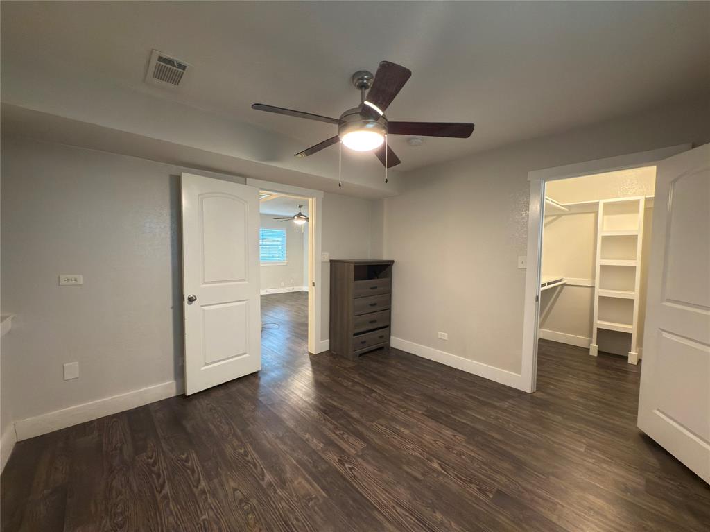 5928 Fletcher Avenue, Unit 2 Fort Worth, TX 76107 - Photo 13 of 20 a view of a livingroom with wooden floor and a ceiling fan