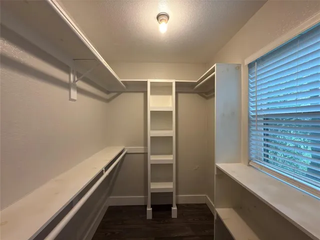 a view of an empty walk in closet