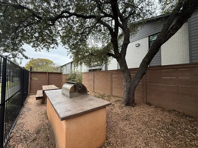 a backyard of a house with seating space