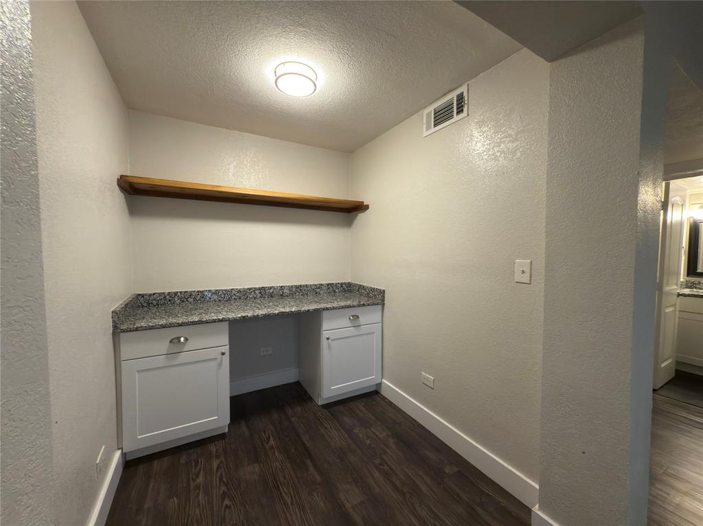 5928 Fletcher Avenue, Unit 2 Fort Worth, TX 76107 - Photo 8 of 20 a view of cabinets and wooden floor