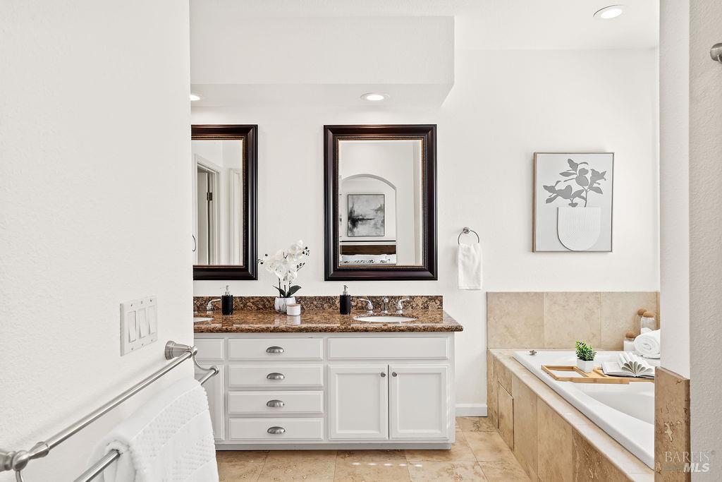 2123 Stonefield Lane Santa Rosa, CA 95403 - Photo 51 of 74 Primary bathroom with dual sinks, soaking tub, stall shower, separate toilet room, and walk in closet.