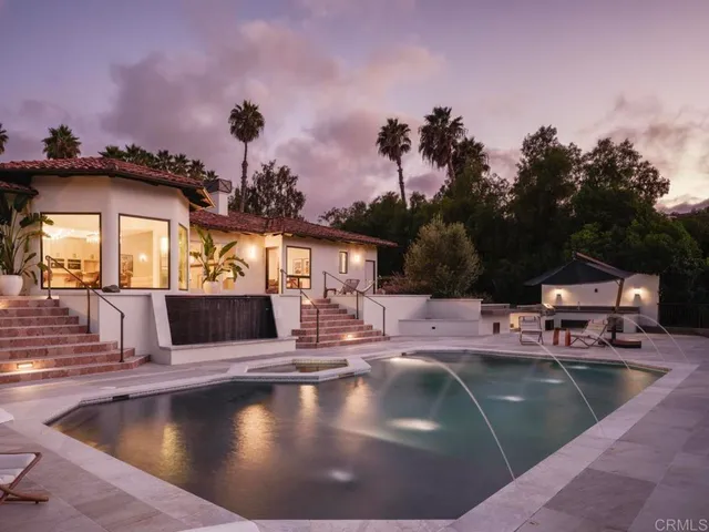 a view of a swimming pool with a lounge chairs