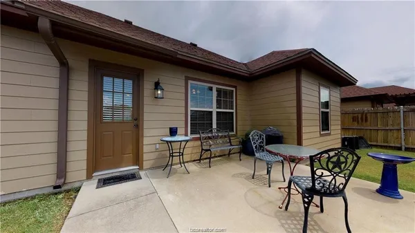 a view of house with outdoor seating space