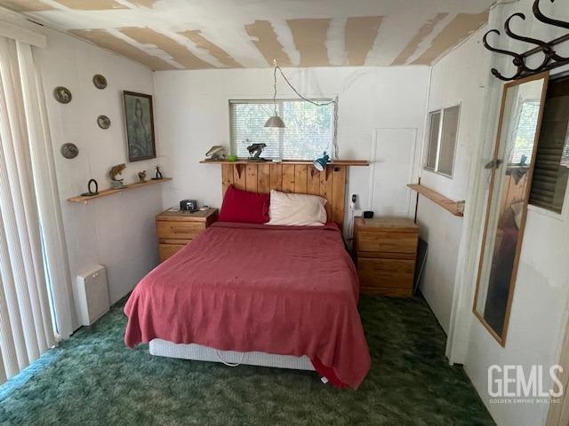 Undisclosed Address Bodfish, CA 93205 - Photo 15 of 19 a bedroom with a bed and a flat tv screen on the dresser