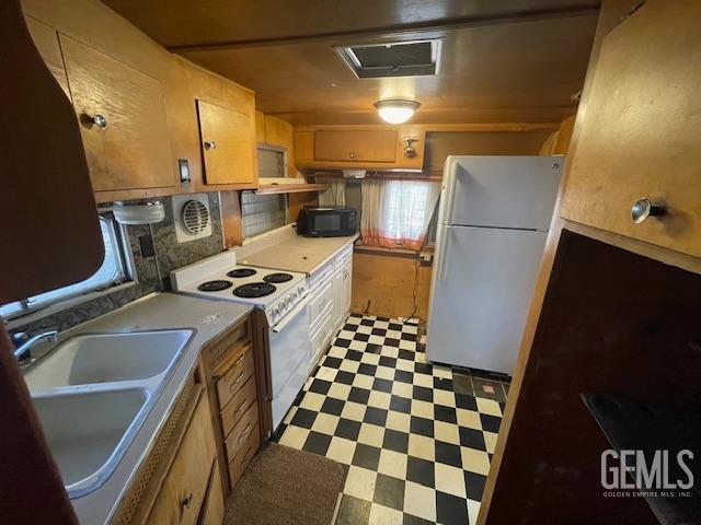 Undisclosed Address Bodfish, CA 93205 - Photo 6 of 19 a kitchen with a refrigerator and a stove